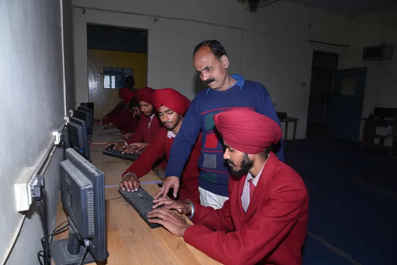 Students in the computer lab with their teacher