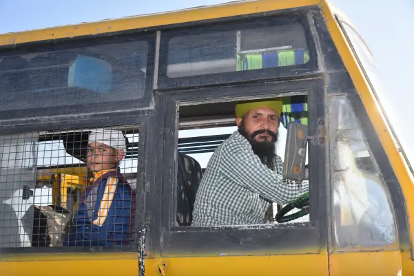 A school bus driver at the wheel