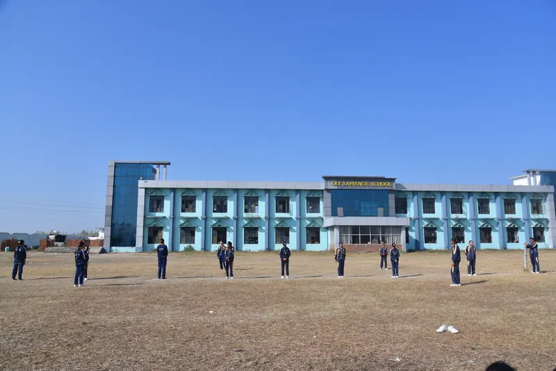 Students on the wide playing ground in front of the school