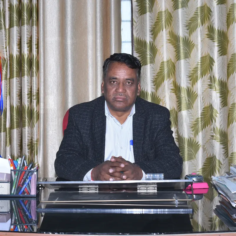 Mr. Hemant Kumar Bora, Principal, at his desk