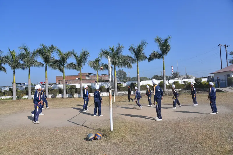 Volleyball practice on the ground under the palms